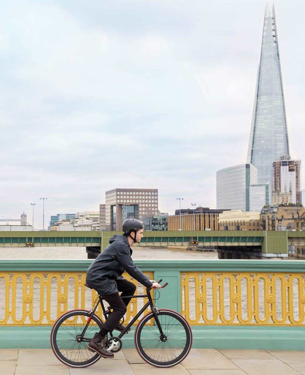 Brigade Court SE1 - man riding bike in London